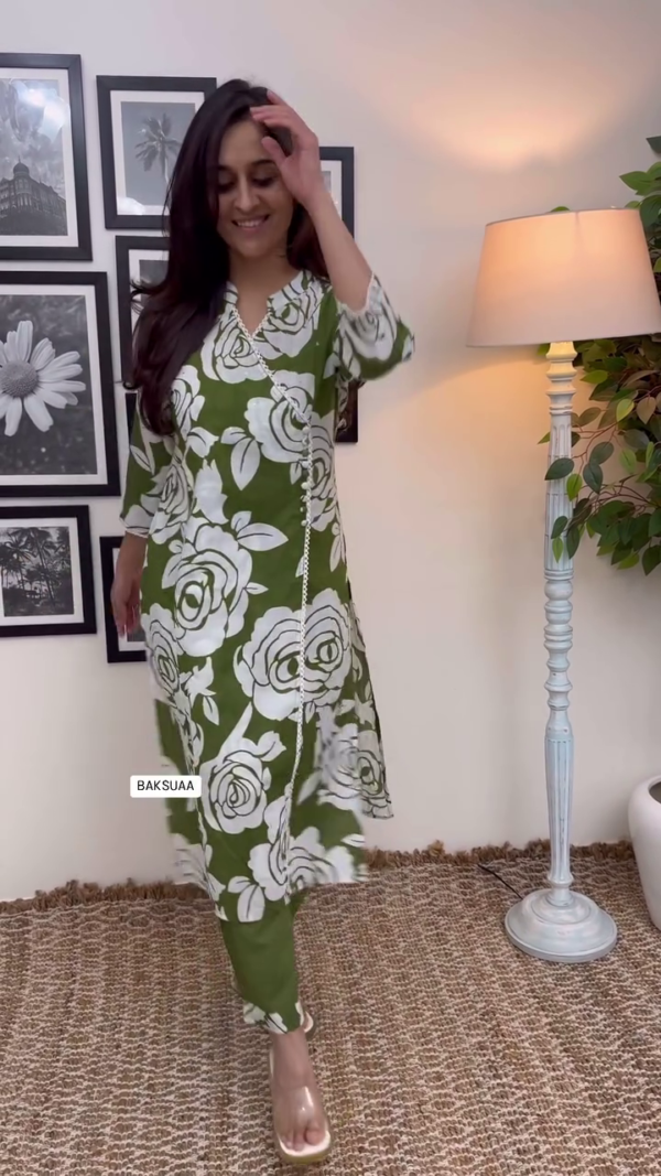 Olive Green and White Floral Printed Cotton Kurta Set with Asymmetric Lace Detailing, Side Fabric Buttons, Subtle Sequin Embellishments, and 3/4th Sleeves Perfect for Casual and Semi-Formal Wear